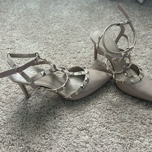 Beige women’s heels with studs